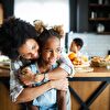 Mother hugging daughter 