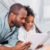 Father and Daughter Reading Together