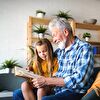 Grandpa and Granddaughter Reading Together